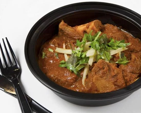 Traditional Goat Curry Indian dish at Pizza Milano & More in Edmonton, AB